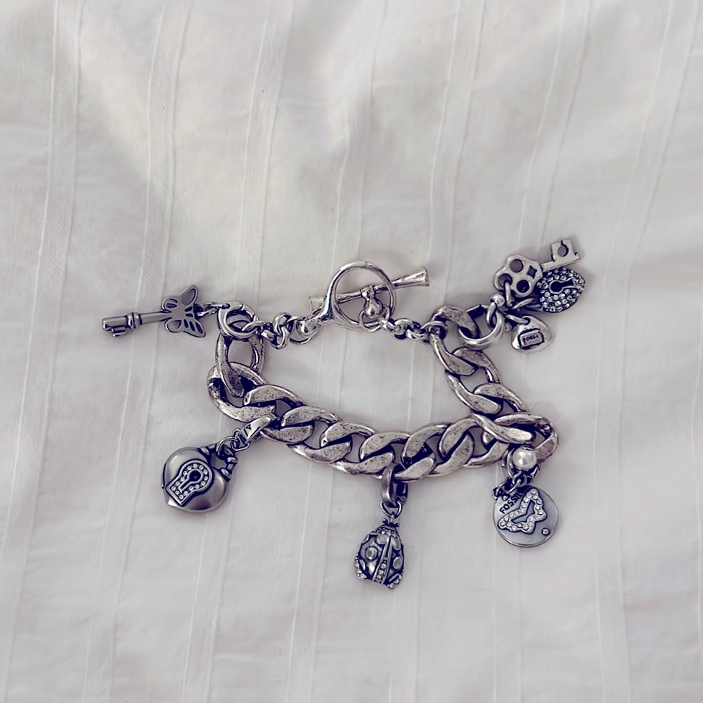 Adorable Fossil charm bracelet.
